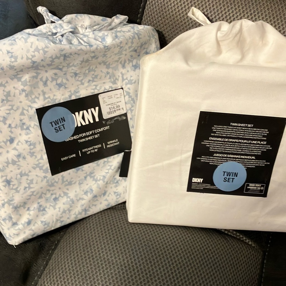DKNY twin sheets. 2 sets, never been used.